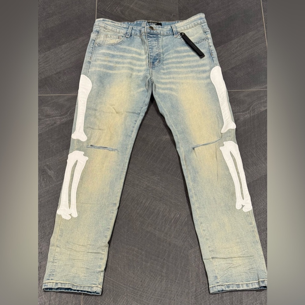 AMIRI Light Blue Jeans with White Skeleton Design